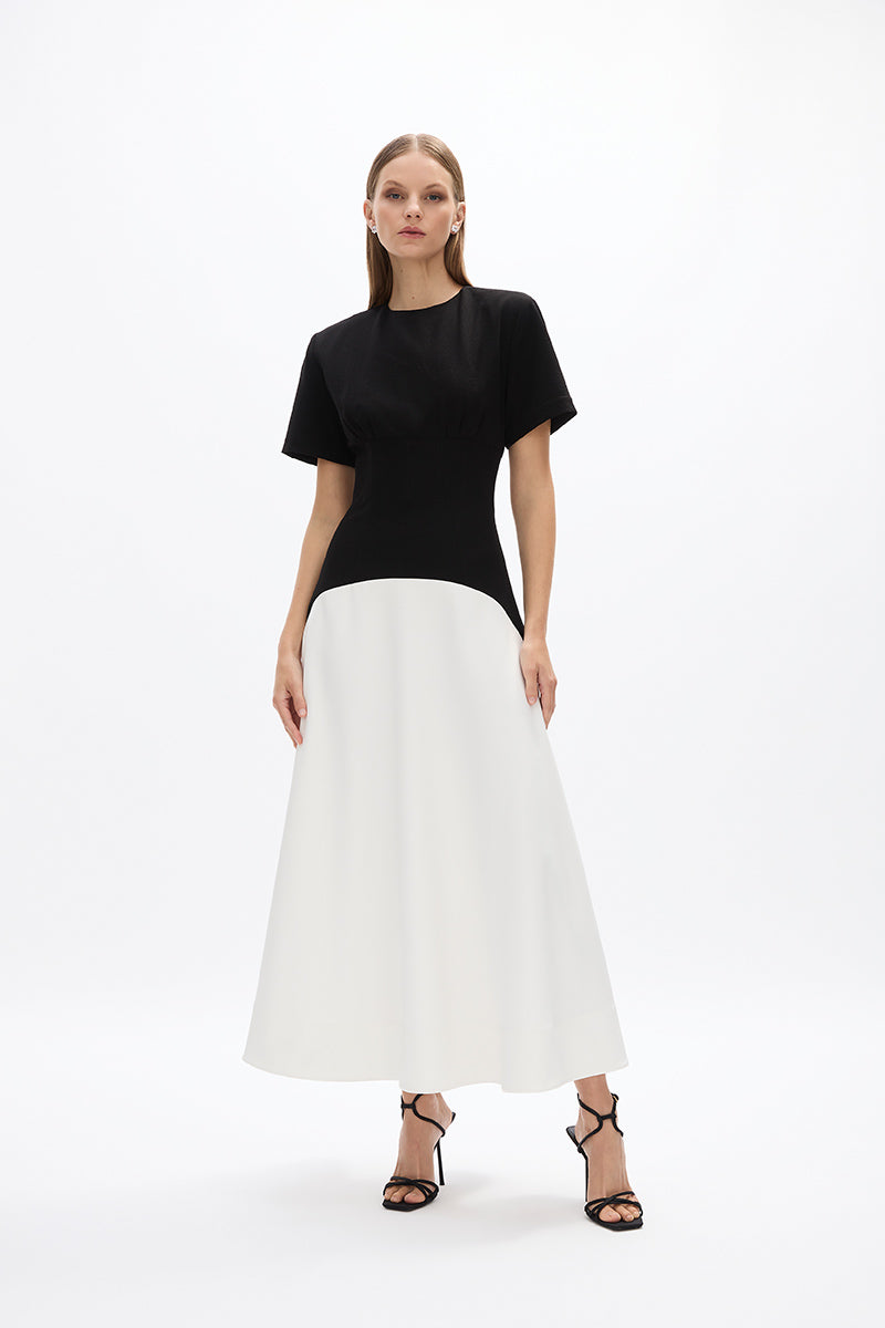 Dover Dress: versatile black and white mid-length dress with short sleeves, perfect for day to night wear. 